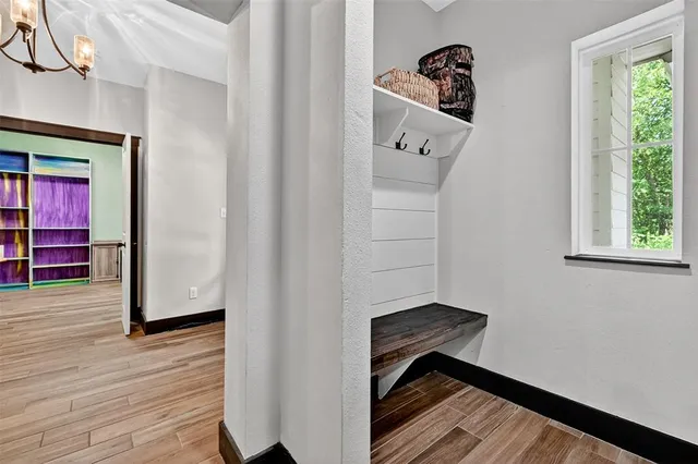 a bathroom with a toilet a sink and a mirror