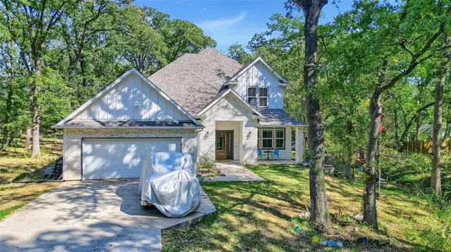 a view of a garden with a building in the back