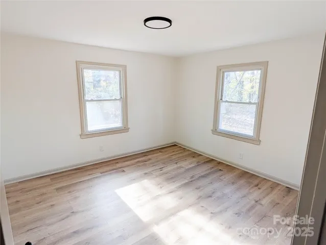 an empty room with windows