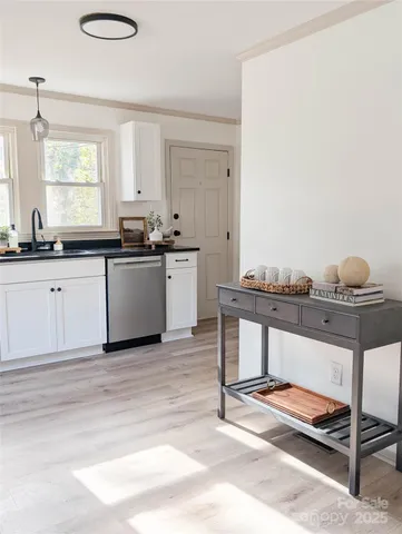 a kitchen with a sink cabinets and window
