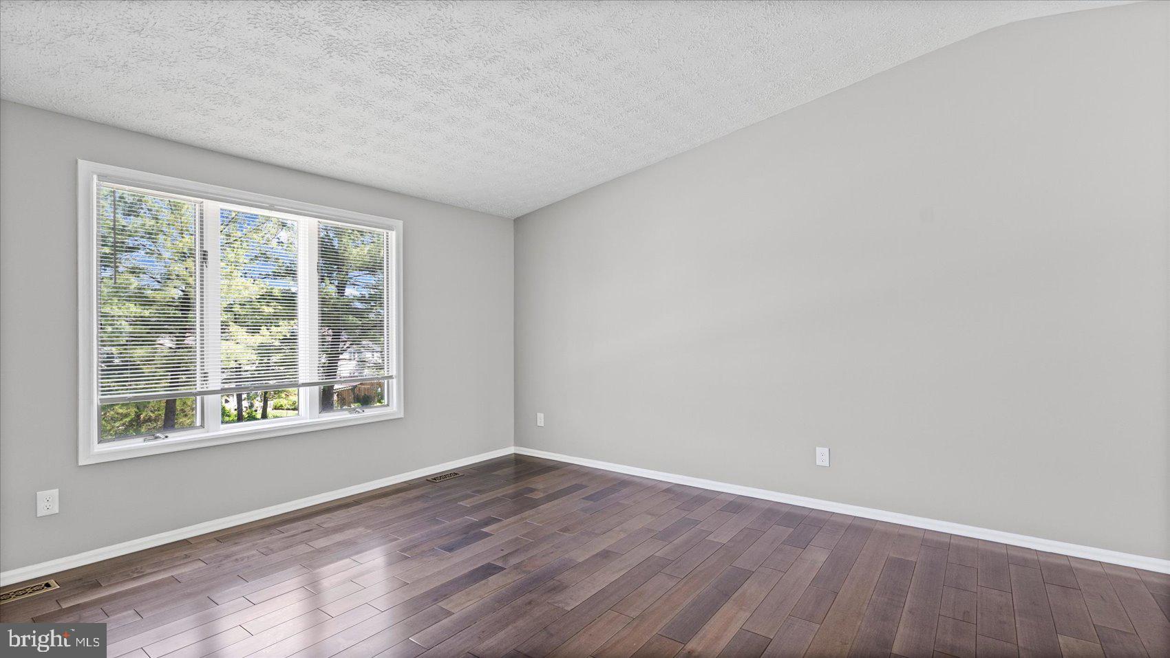 3709 Redberry Way Nottingham, MD 21236 - Photo 5 of 45 an empty room with wooden floor and windows