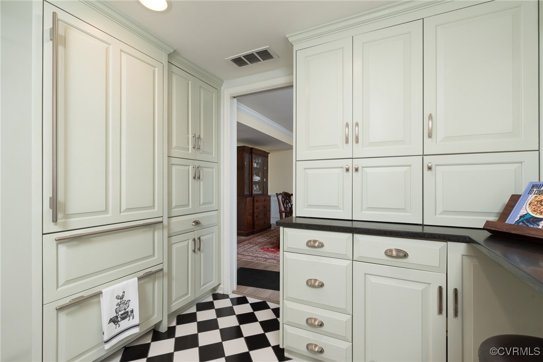 9111 Derbyshire Road, Unit I Henrico, VA 23229 - Photo 6 of 22 a kitchen with white cabinets and white appliances