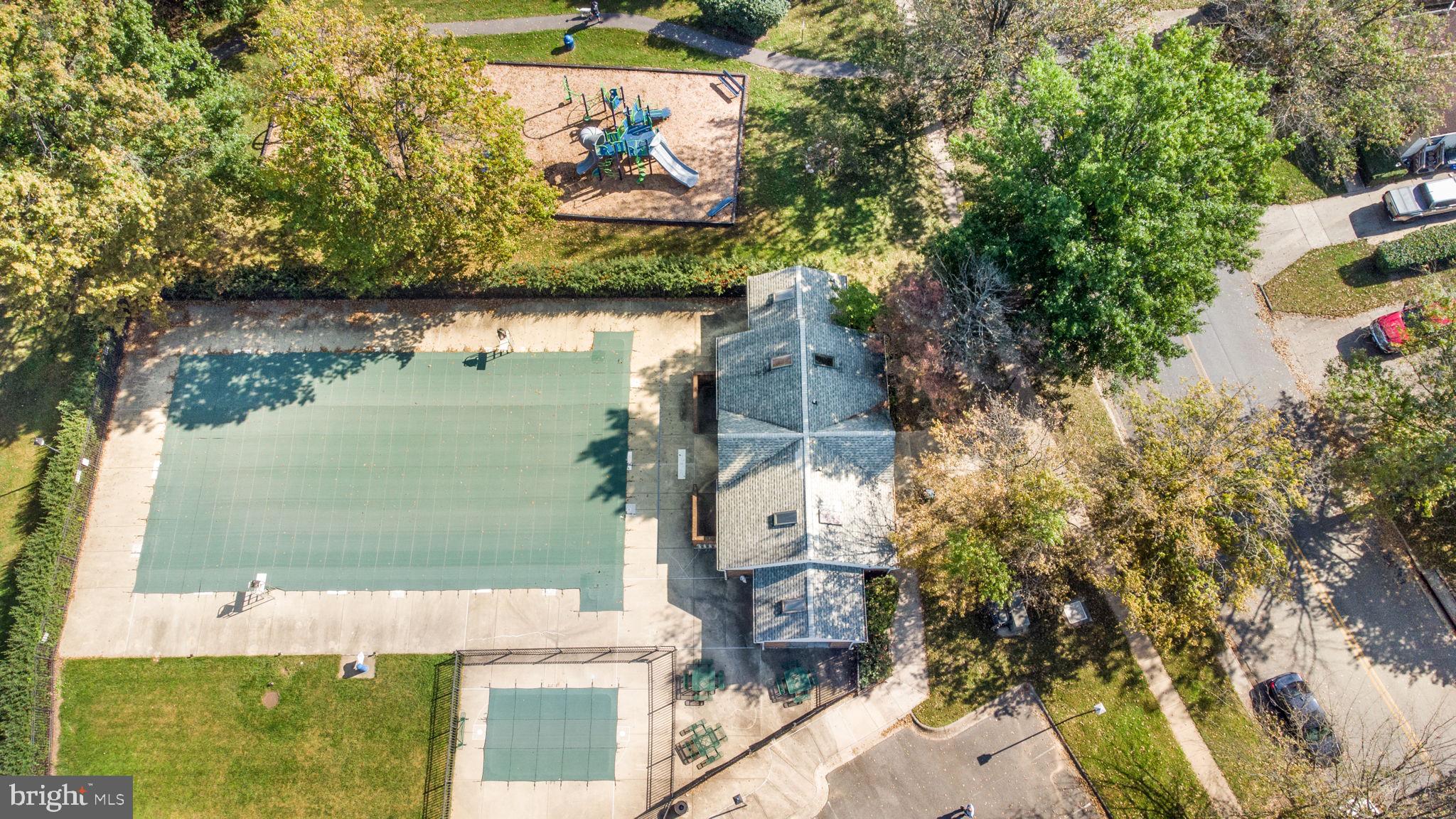 7316 Torran Rocks Way Gaithersburg, MD 20879 - Photo 16 of 17 an aerial view of a house with a yard and large trees