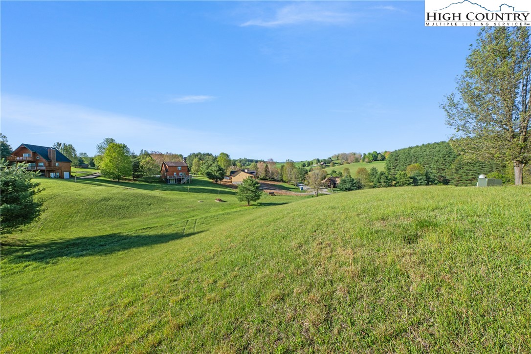 29 Pond View Lane Sparta, NC 28675 - Photo 21 of 27 a view of a grassy field with trees