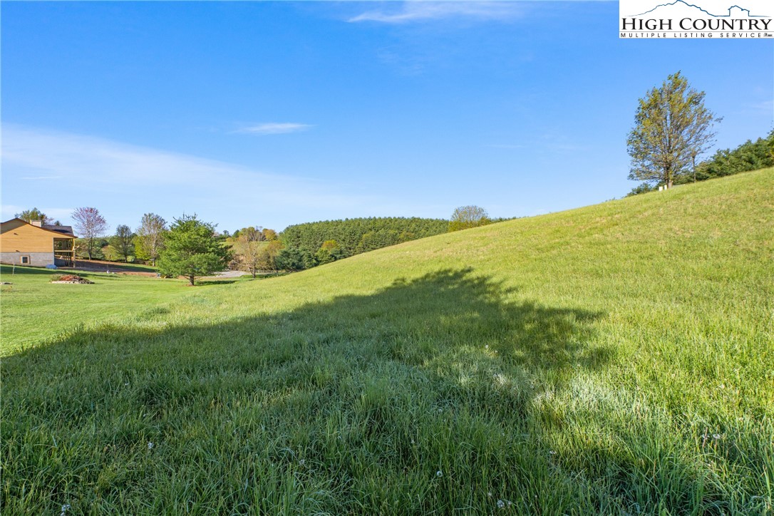 29 Pond View Lane Sparta, NC 28675 - Photo 22 of 27 a view of a field with an ocean