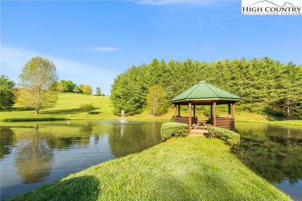 a view of a lake with a big yard