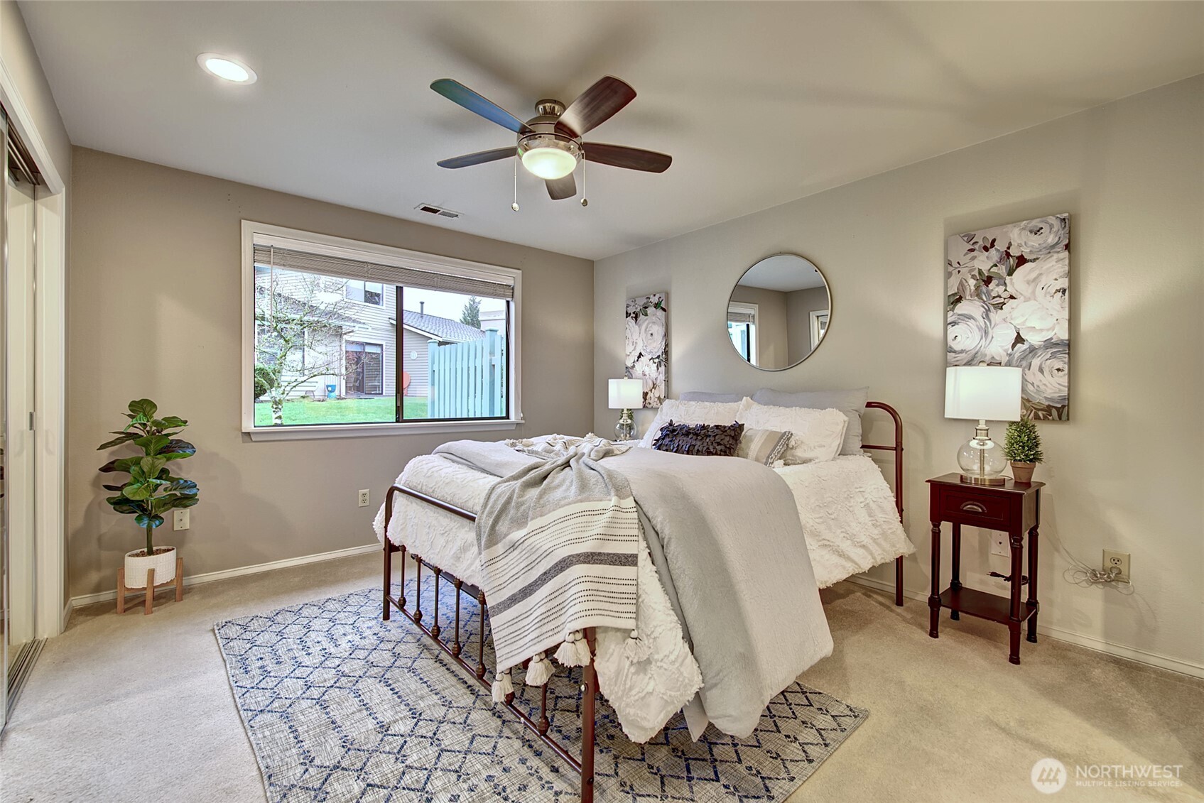 1800 Mill Creek Road, Unit 4A Mill Creek, WA 98012 - Photo 16 of 32 a bedroom with a large bed and a chandelier