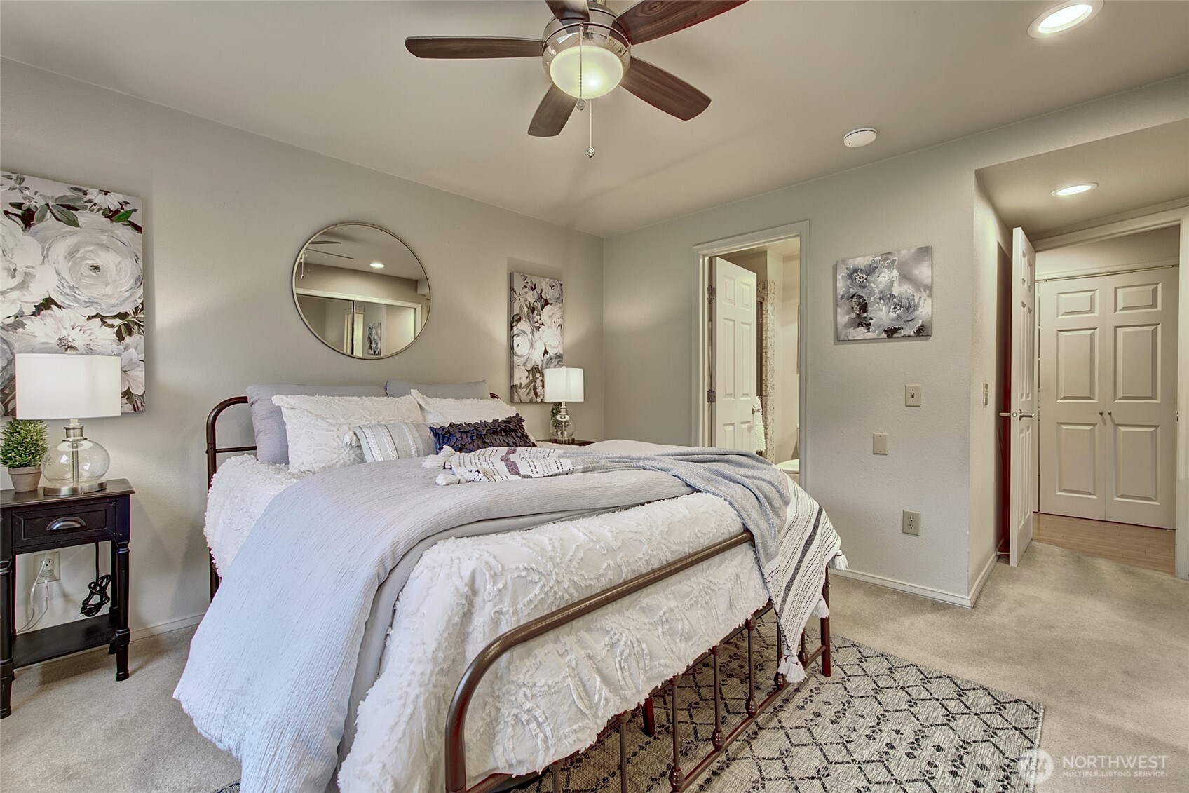 1800 Mill Creek Road, Unit 4A Mill Creek, WA 98012 - Photo 17 of 32 a bedroom with a bed and a chandelier