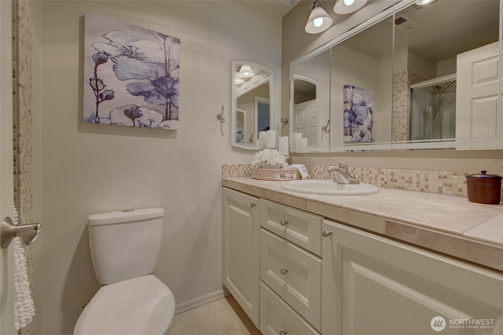 1800 Mill Creek Road, Unit 4A Mill Creek, WA 98012 - Photo 19 of 32 a bathroom with a toilet a sink and mirror