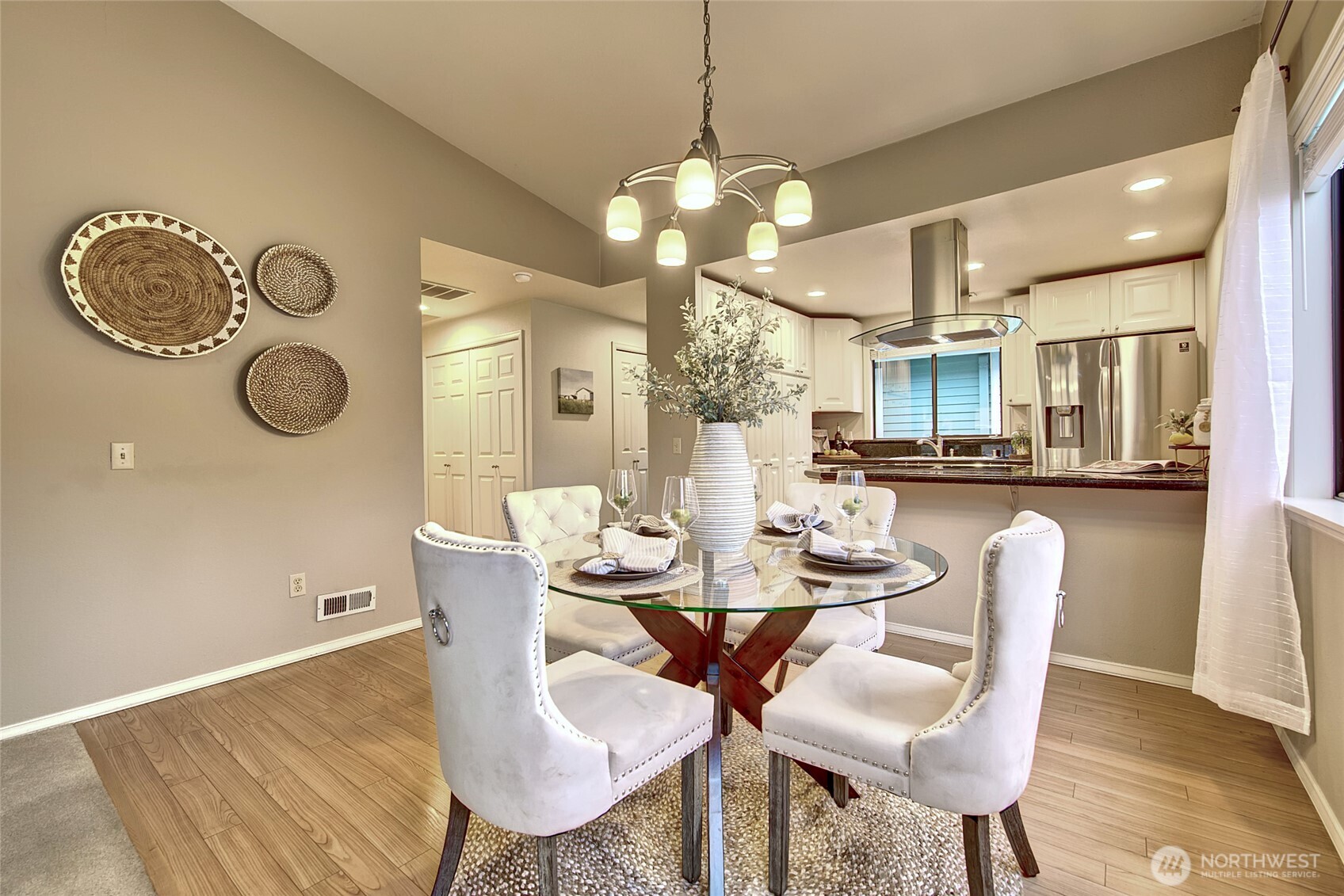 1800 Mill Creek Road, Unit 4A Mill Creek, WA 98012 - Photo 29 of 32 a dining room with furniture and a chandelier