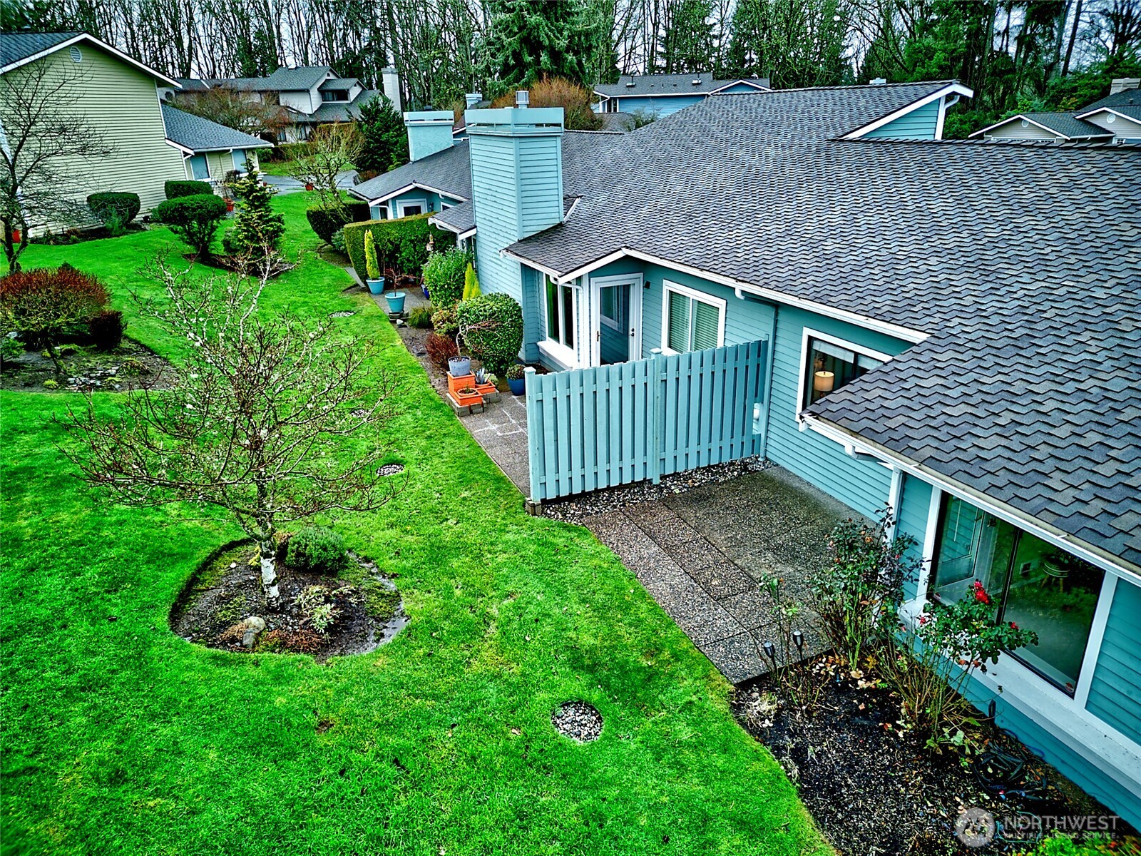 1800 Mill Creek Road, Unit 4A Mill Creek, WA 98012 - Photo 31 of 32 a front view of a house with a garden