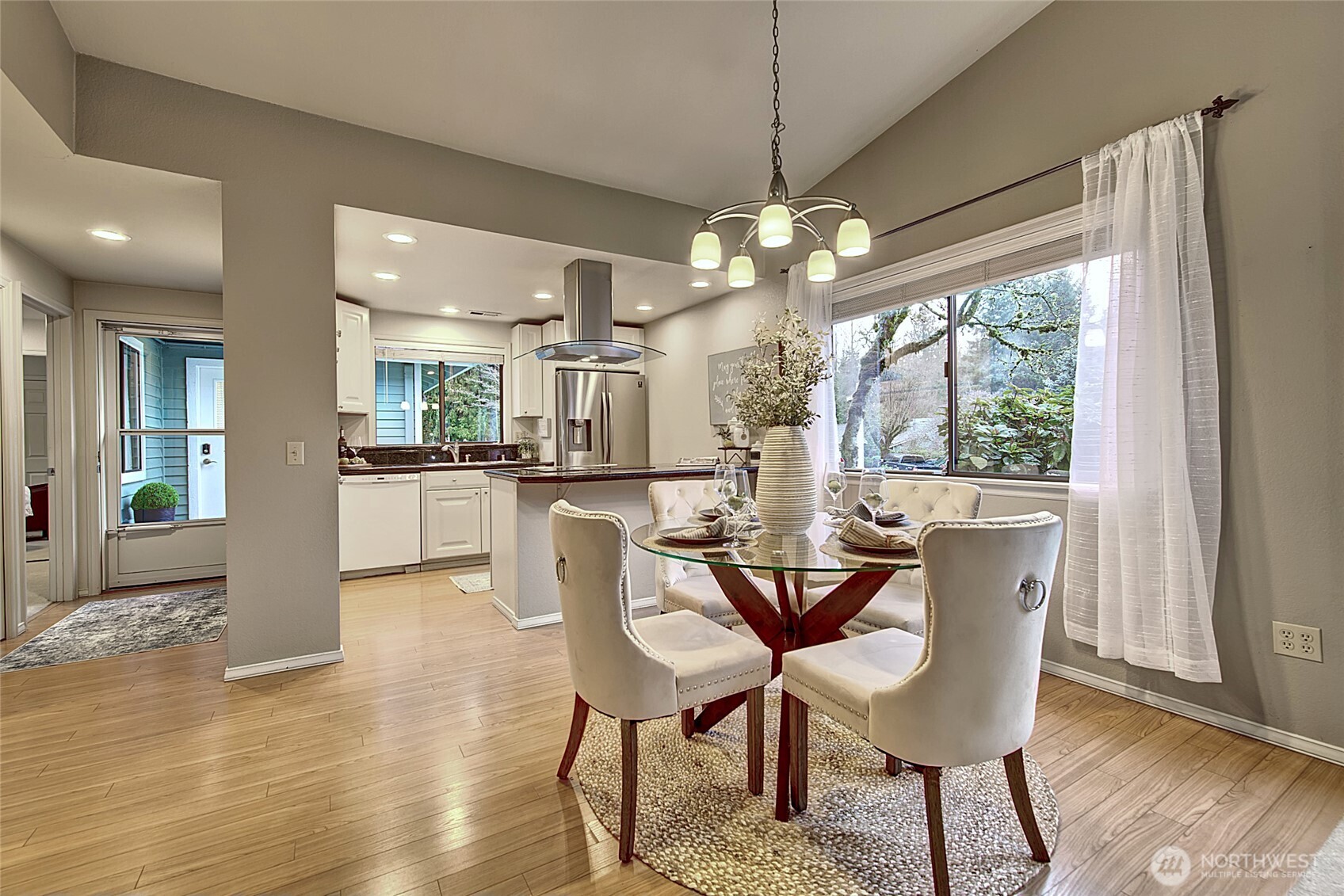 1800 Mill Creek Road, Unit 4A Mill Creek, WA 98012 - Photo 7 of 32 a view of a dining room with furniture window and wooden floor
