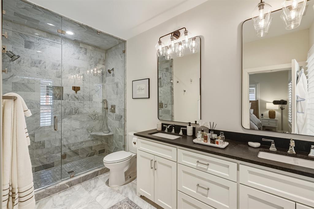 5250 Goodwin Avenue Dallas, TX 75206 - Photo 17 of 33 a bathroom with a double vanity sink toilet and shower