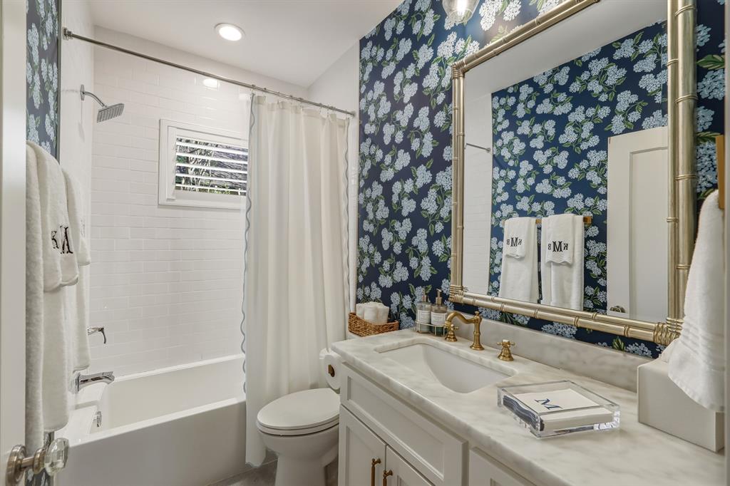 5250 Goodwin Avenue Dallas, TX 75206 - Photo 20 of 33 a bathroom with a granite countertop sink toilet and shower