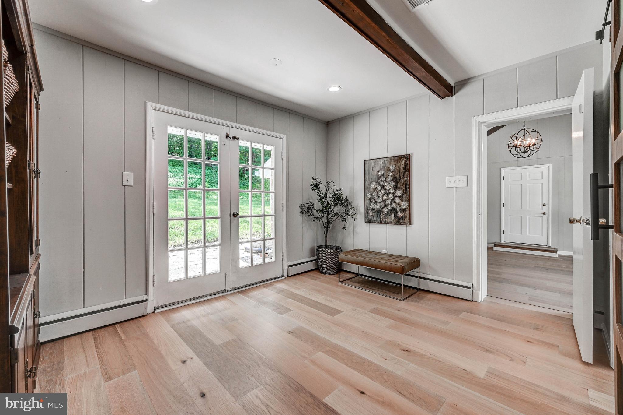 1311 Milldam Road Baltimore, MD 21286 - Photo 14 of 27 a view of workspace with wooden floor and windows
