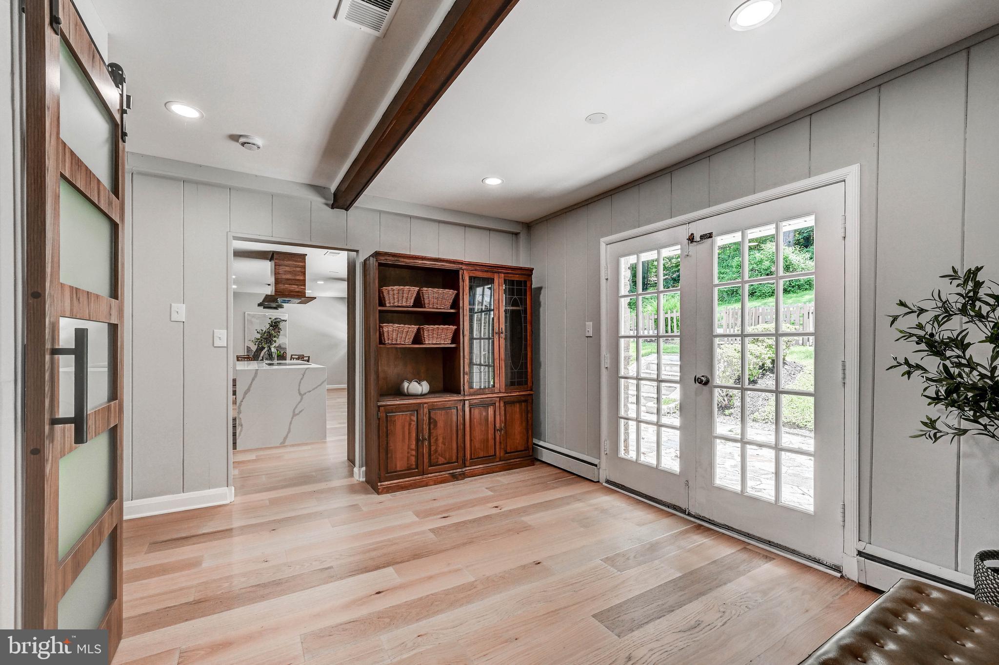1311 Milldam Road Baltimore, MD 21286 - Photo 17 of 27 a view of workspace with wooden floor and windows