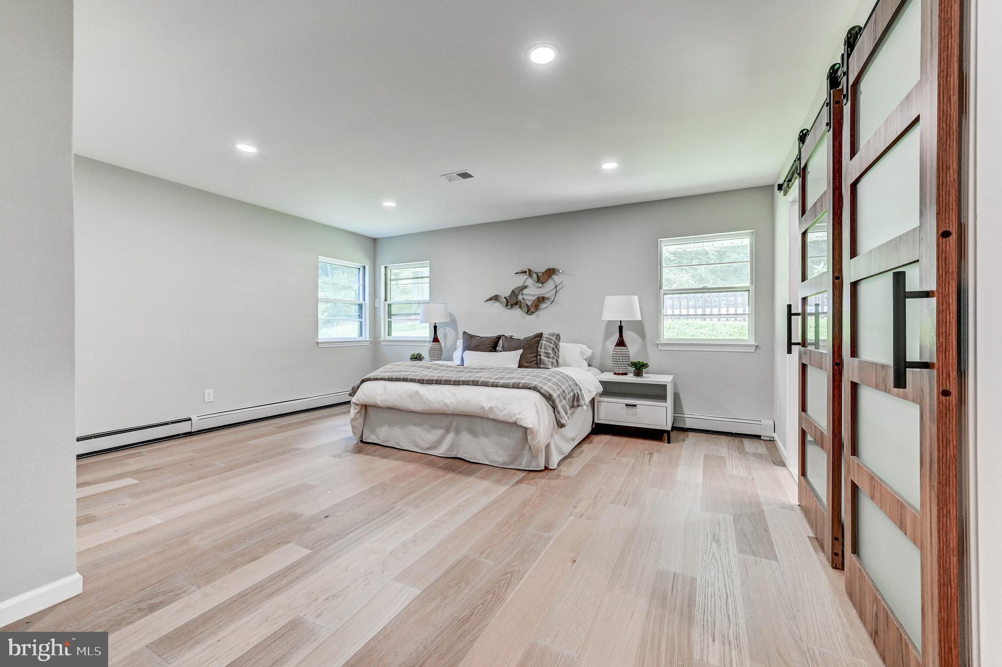 1311 Milldam Road Baltimore, MD 21286 - Photo 20 of 27 a bedroom with a bed and a large window