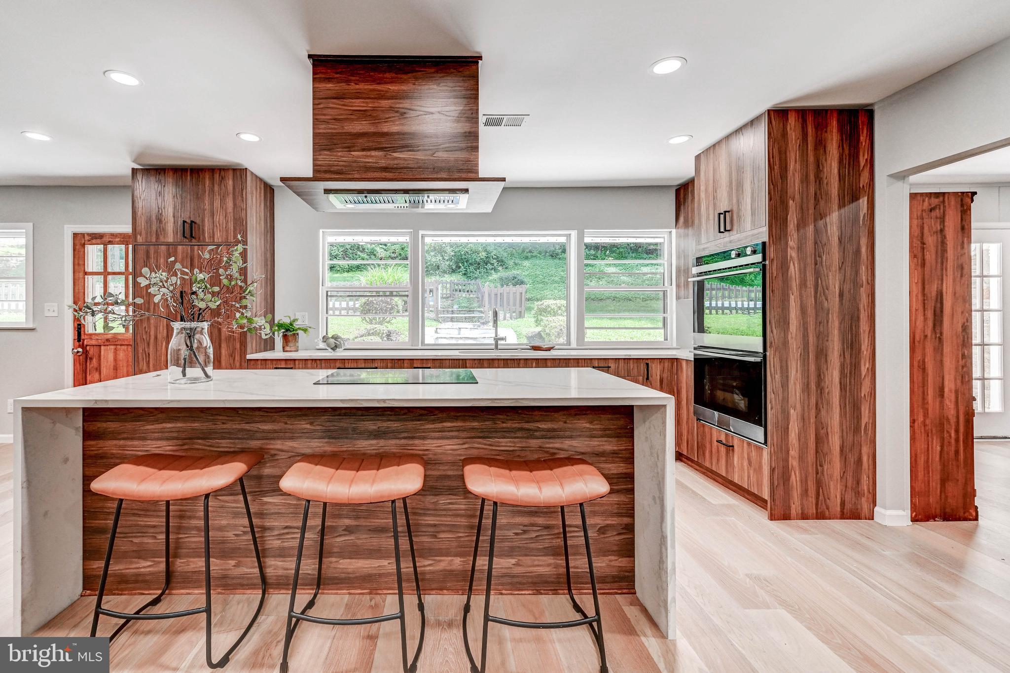 1311 Milldam Road Baltimore, MD 21286 - Photo 22 of 27 a dining table chair in a kitchen next to a window