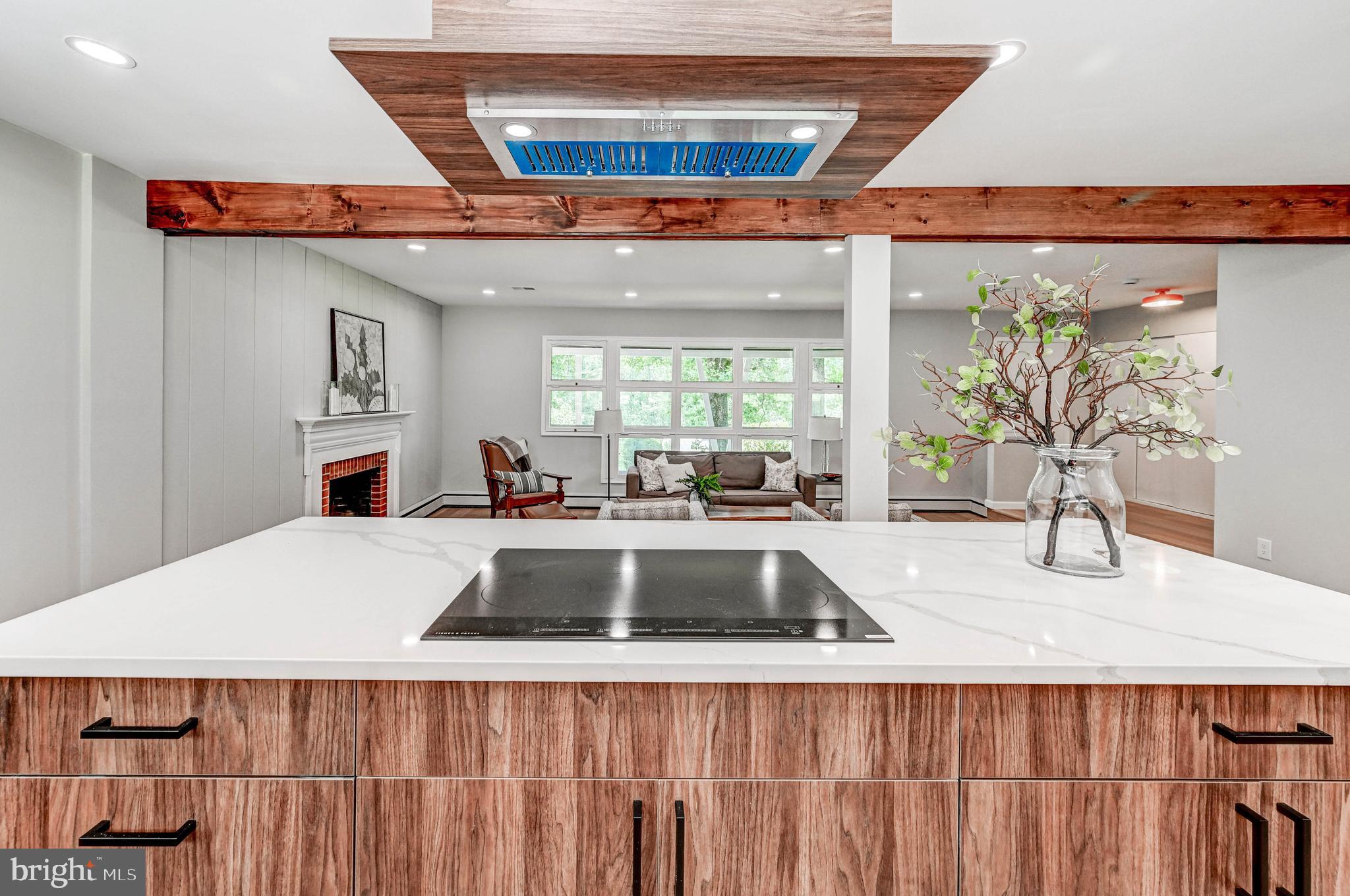 1311 Milldam Road Baltimore, MD 21286 - Photo 25 of 27 a living room with stainless steel appliances kitchen island a large counter top space and a kitchen view