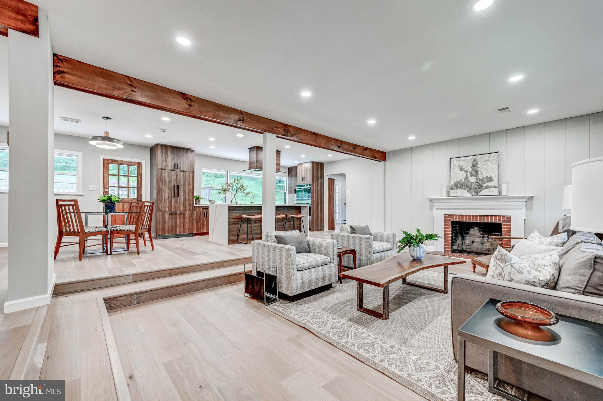 1311 Milldam Road Baltimore, MD 21286 - Photo 4 of 27 a living room with furniture and a fireplace