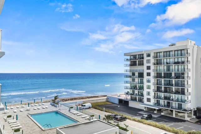 a living room with stainless steel appliances kitchen island granite countertop furniture and a kitchen view