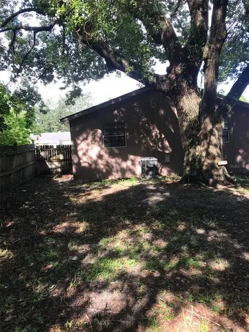 a view of a yard outside of a house