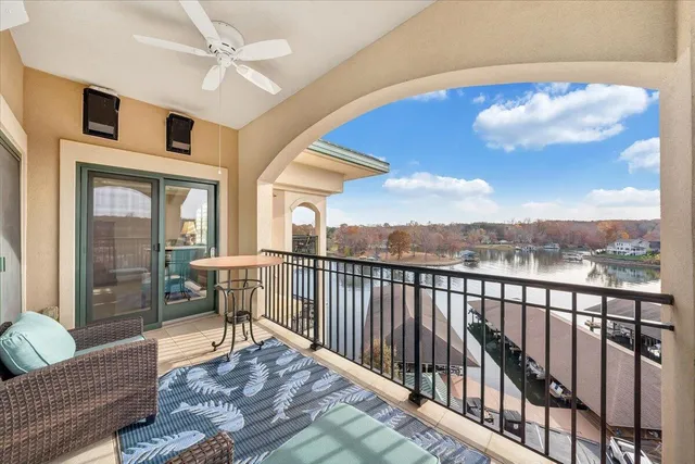a view of a balcony with furniture