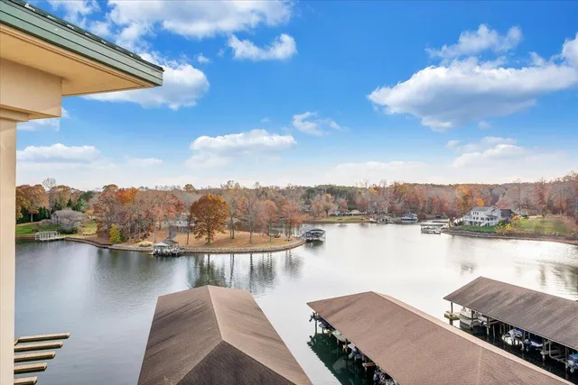 a view of a lake with houses in the back