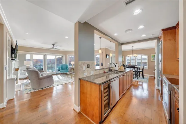 a large kitchen with stainless steel appliances lots of counter top space