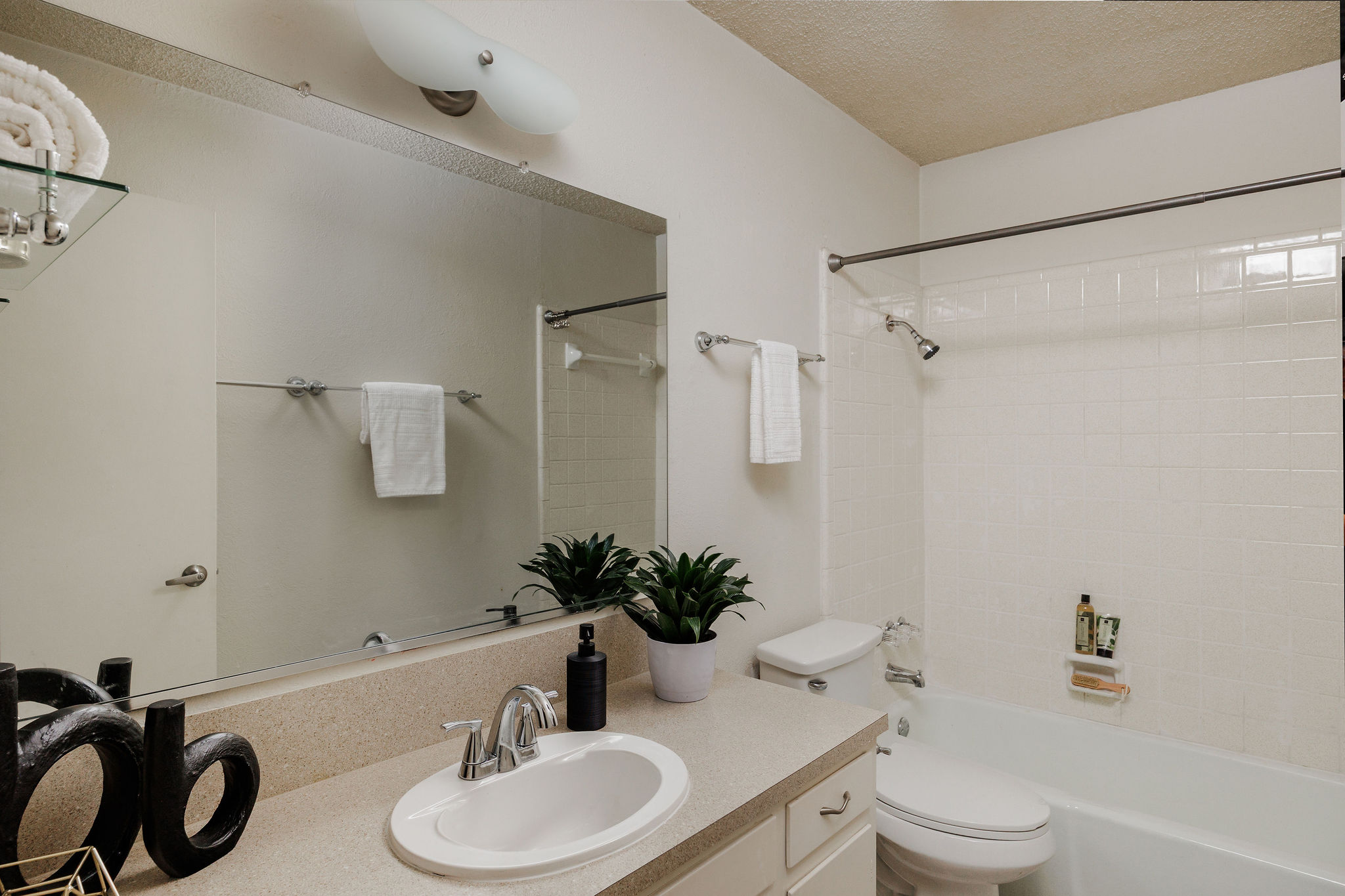2012 Cody Court Austin, TX 78704 - Photo 17 of 40 A pristine bathroom features a shower-tub combination and a vanity with ample counter space.