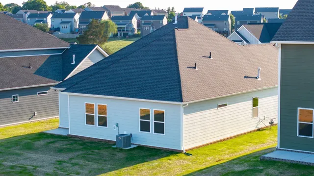 a view of a house with a backyard
