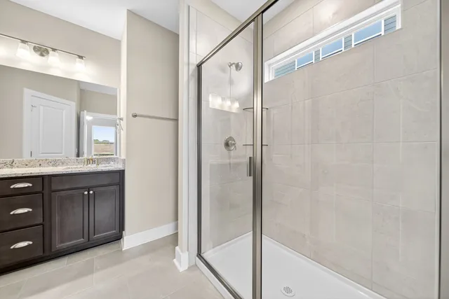 a view of a big house with a big yard and large trees