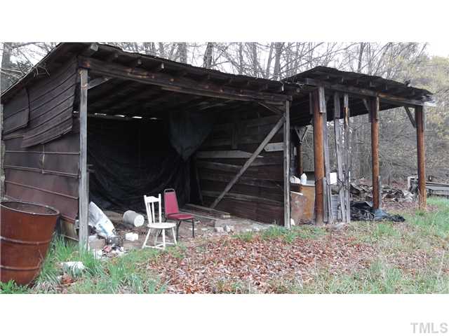 731 Barnette Tingen Road Roxboro, NC 27574 - Photo 11 of 11 a backyard of a house with table and chairs