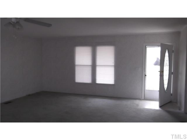 731 Barnette Tingen Road Roxboro, NC 27574 - Photo 2 of 11 a black and white photo of a living room