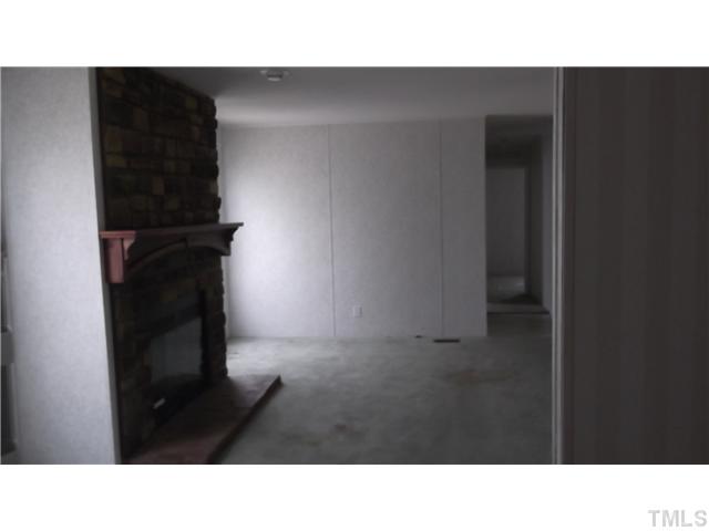 731 Barnette Tingen Road Roxboro, NC 27574 - Photo 3 of 11 a black and white photo of a living room