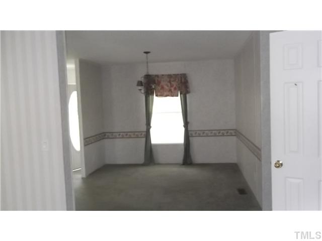 731 Barnette Tingen Road Roxboro, NC 27574 - Photo 5 of 11 a black and white photo of a room