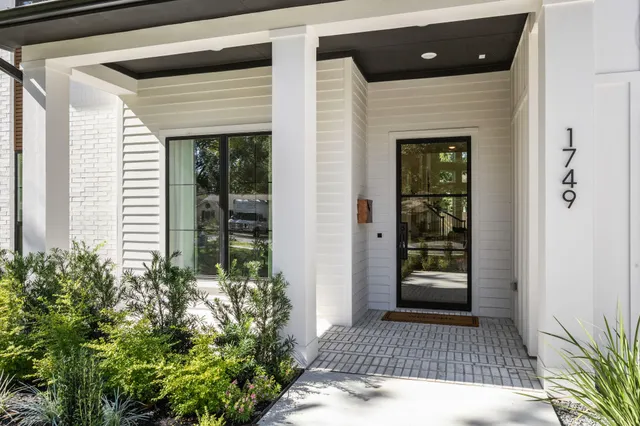 a front view of a house with a porch