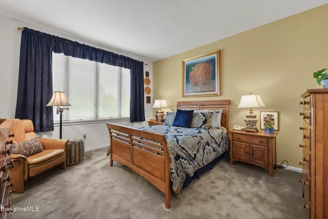 a bed room with a bed and a couch