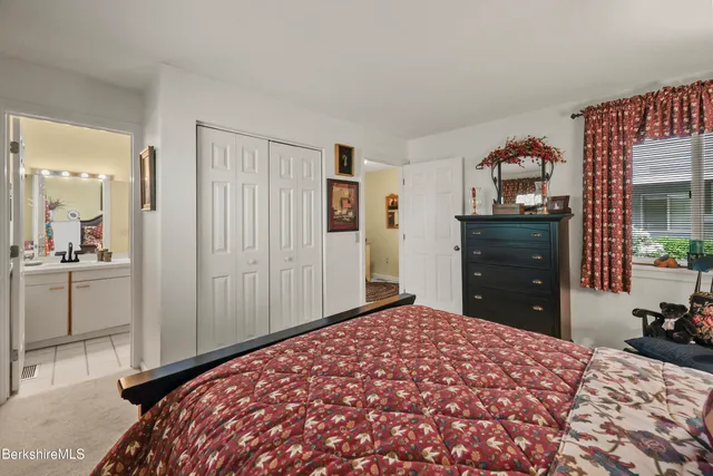 a bedroom with a bed and a cabinets