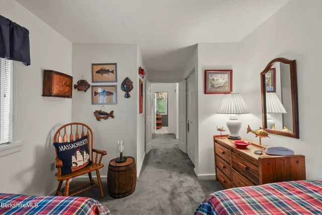 a bedroom with furniture and a window