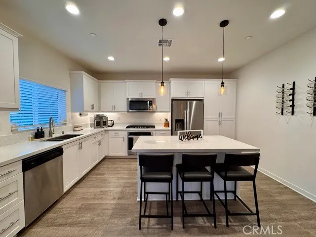 a kitchen with lots of counter top space and living room