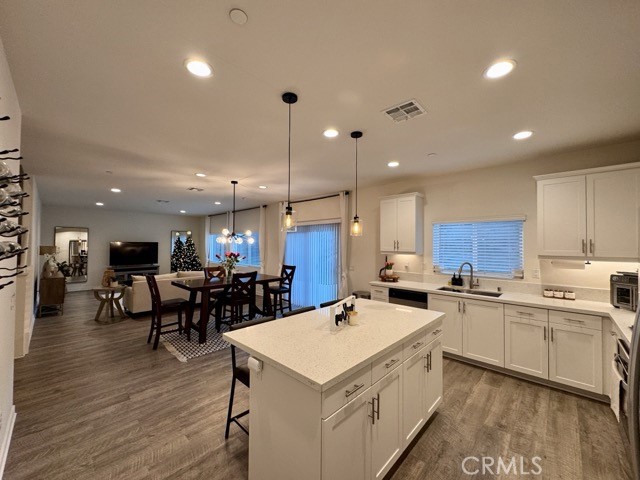 30411 Ridgecrest Road Winchester, CA 92596 - Photo 15 of 46 a kitchen with lots of counter top space and living room