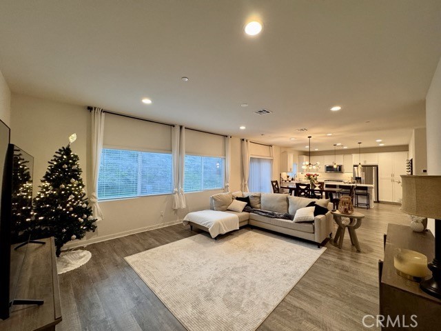 30411 Ridgecrest Road Winchester, CA 92596 - Photo 21 of 46 a living room with furniture flowers and a potted plant