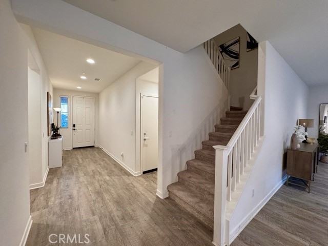 30411 Ridgecrest Road Winchester, CA 92596 - Photo 23 of 46 a view of a hallway view with wooden floor and staircase