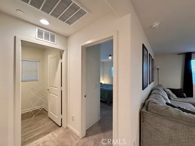 a bedroom with a bed and a lamp