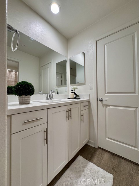 30411 Ridgecrest Road Winchester, CA 92596 - Photo 34 of 46 a spacious bathroom with a double vanity sink a mirror and a shower