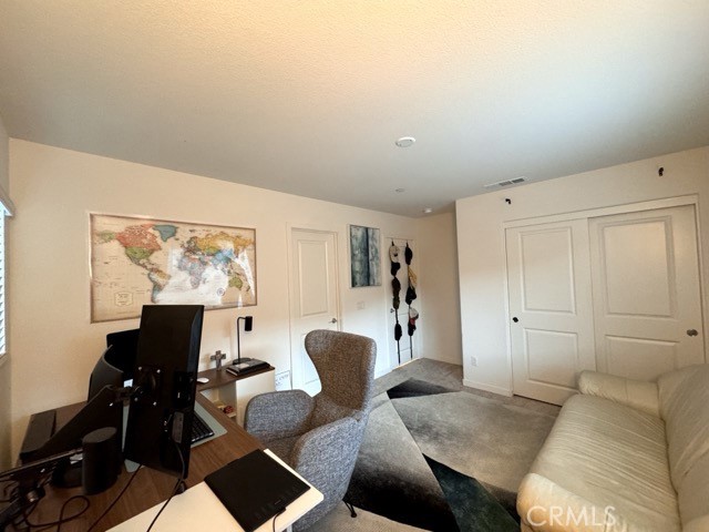 30411 Ridgecrest Road Winchester, CA 92596 - Photo 37 of 46 a living room with furniture and a flat screen tv