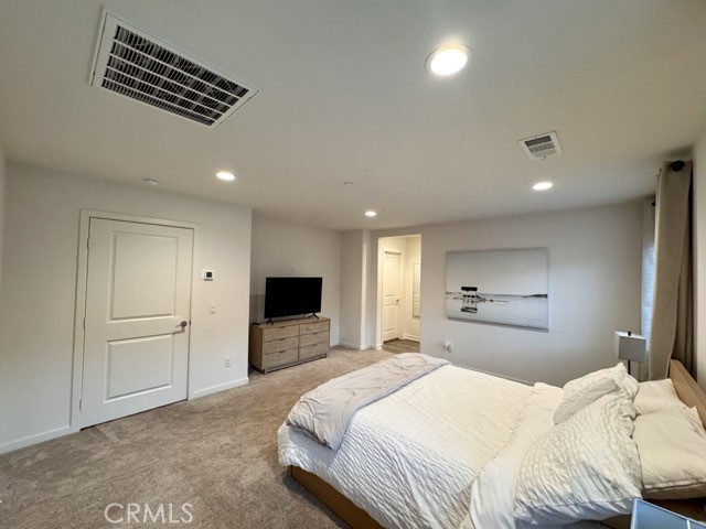 30411 Ridgecrest Road Winchester, CA 92596 - Photo 39 of 46 a bedroom with a bed and a television