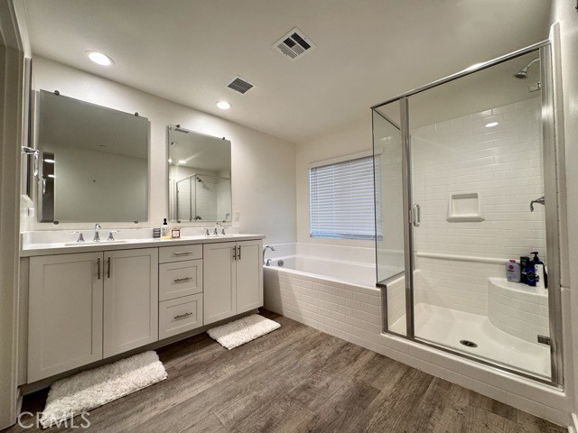 30411 Ridgecrest Road Winchester, CA 92596 - Photo 40 of 46 a spacious bathroom with a shower tub double and sink