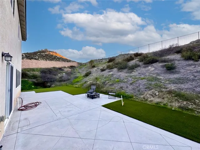 a view of outdoor space with garden and mountain view in back